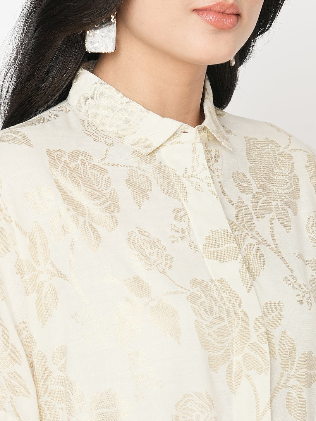 Featuring a foliage gold print confort fit shirt with drop shoulder that moves from Nine to wine