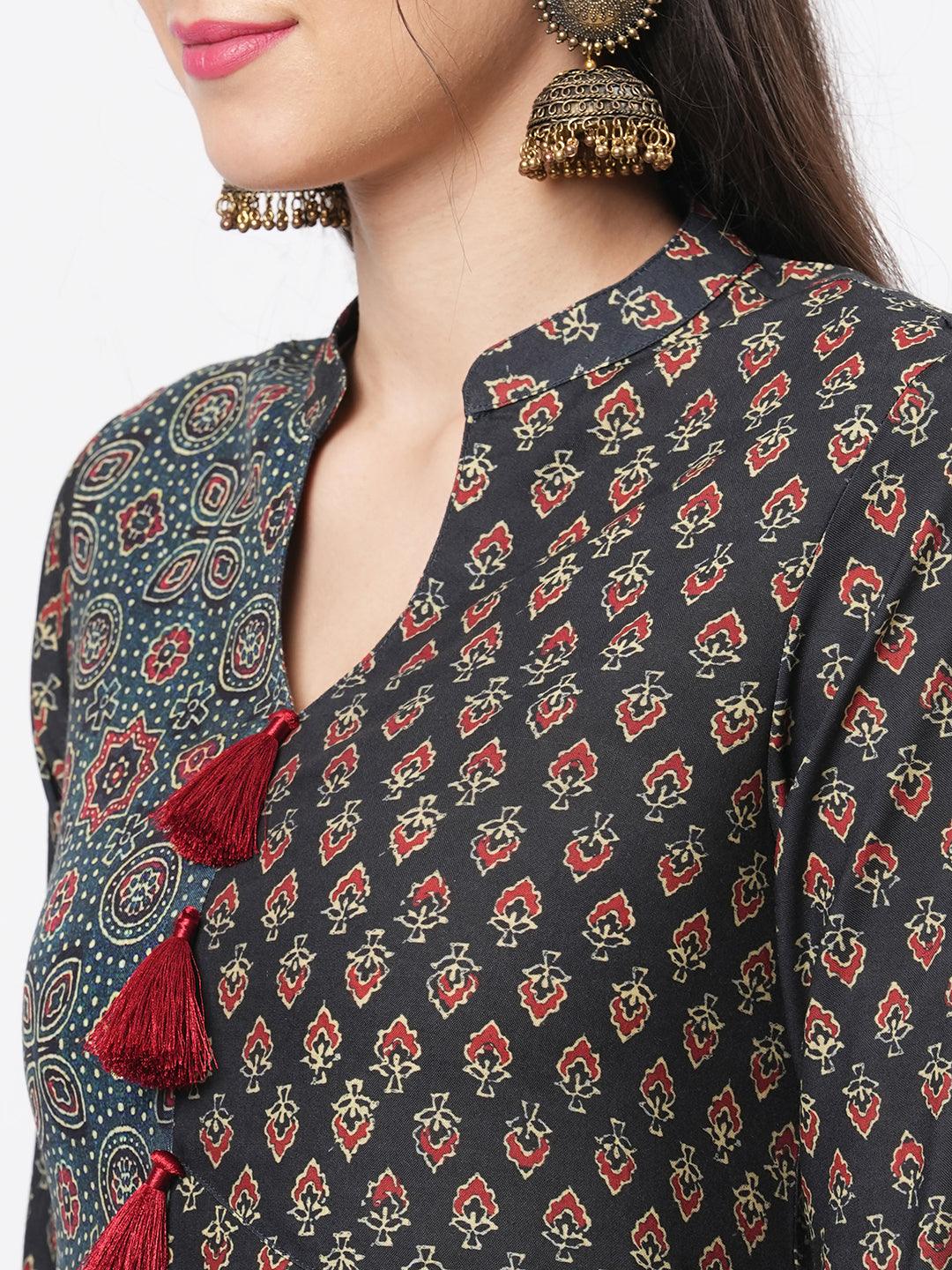 Hashtag Be forest green two print long flared kurta complimenting each other with contrast color tassel at the neck.