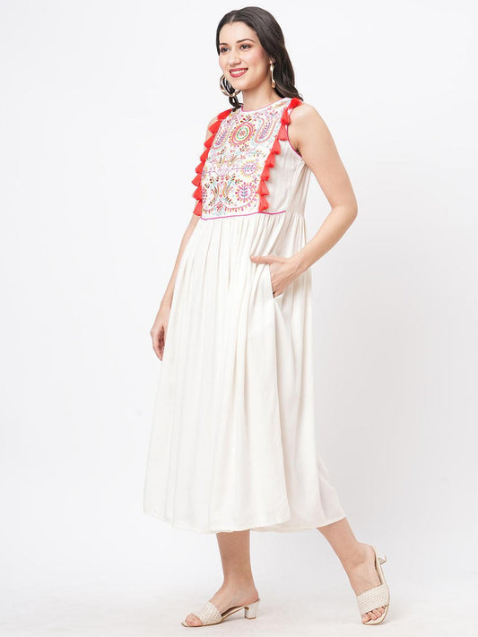 Hashtag Be Featuring a Offwhite boho calf length airy dress with tassel and embroidery