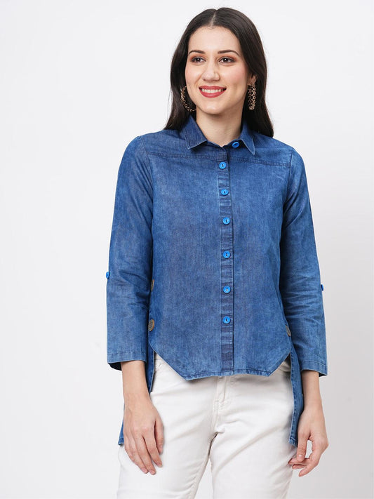 Hashtag Be Denim blue in sturdy washed cotton shirt with collar and button down front and high low hem with embroidery at the back