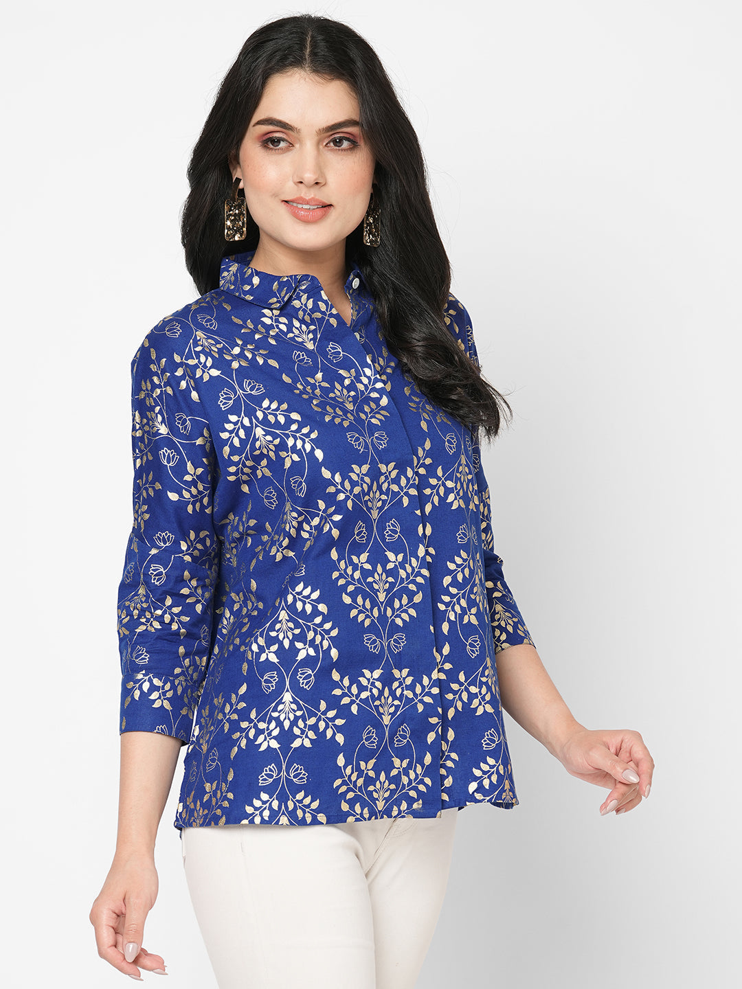 Featuring a foliage gold print confort fit shirt with drop shoulder that moves from Nine to wine