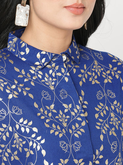 Featuring a foliage gold print confort fit shirt with drop shoulder that moves from Nine to wine