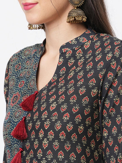 Hashtag Be forest green two print long flared kurta complimenting each other with contrast color tassel at the neck.
