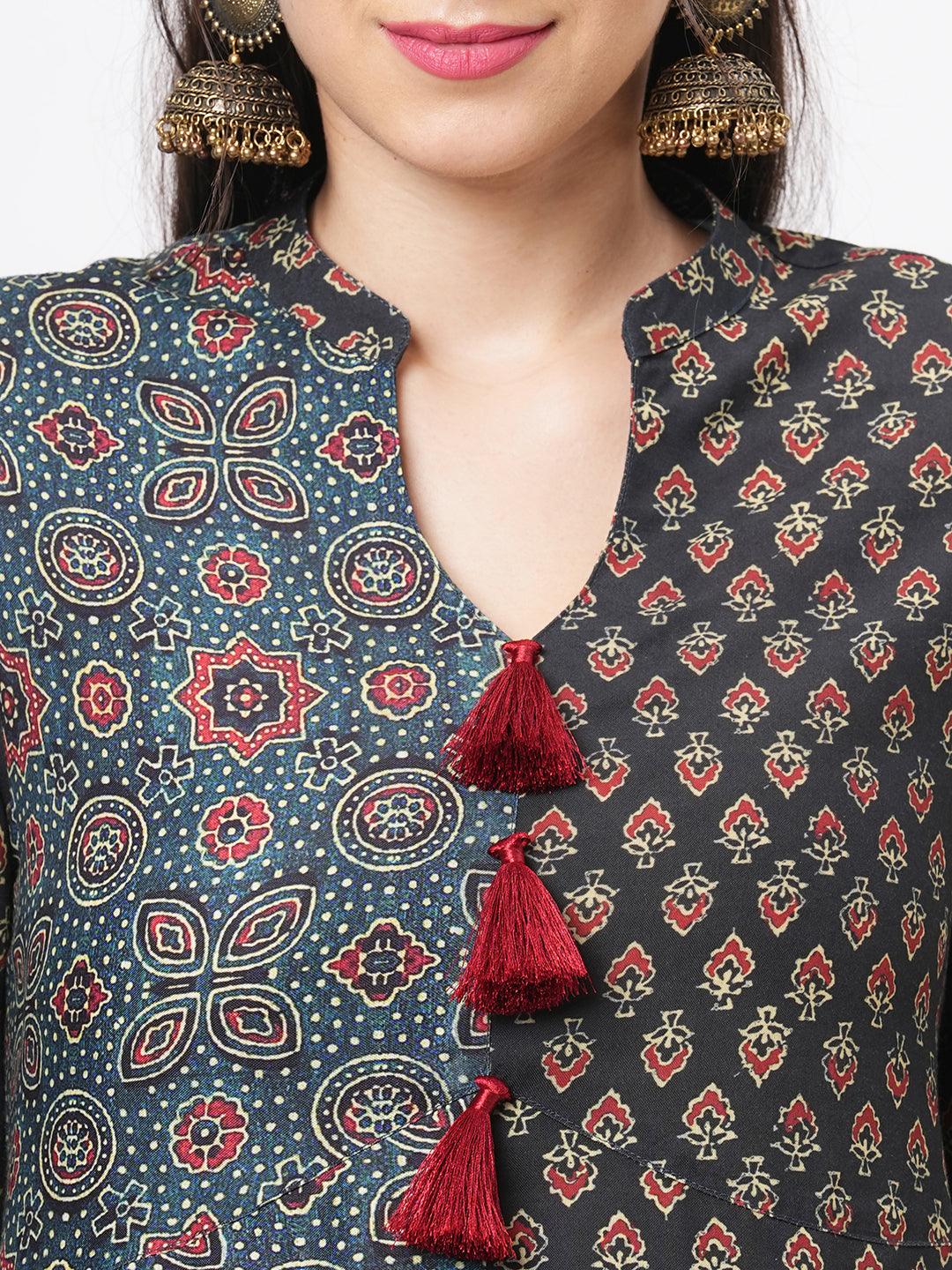 Hashtag Be forest green two print long flared kurta complimenting each other with contrast color tassel at the neck.