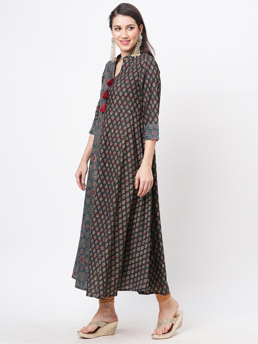 Hashtag Be forest green two print long flared kurta complimenting each other with contrast color tassel at the neck.