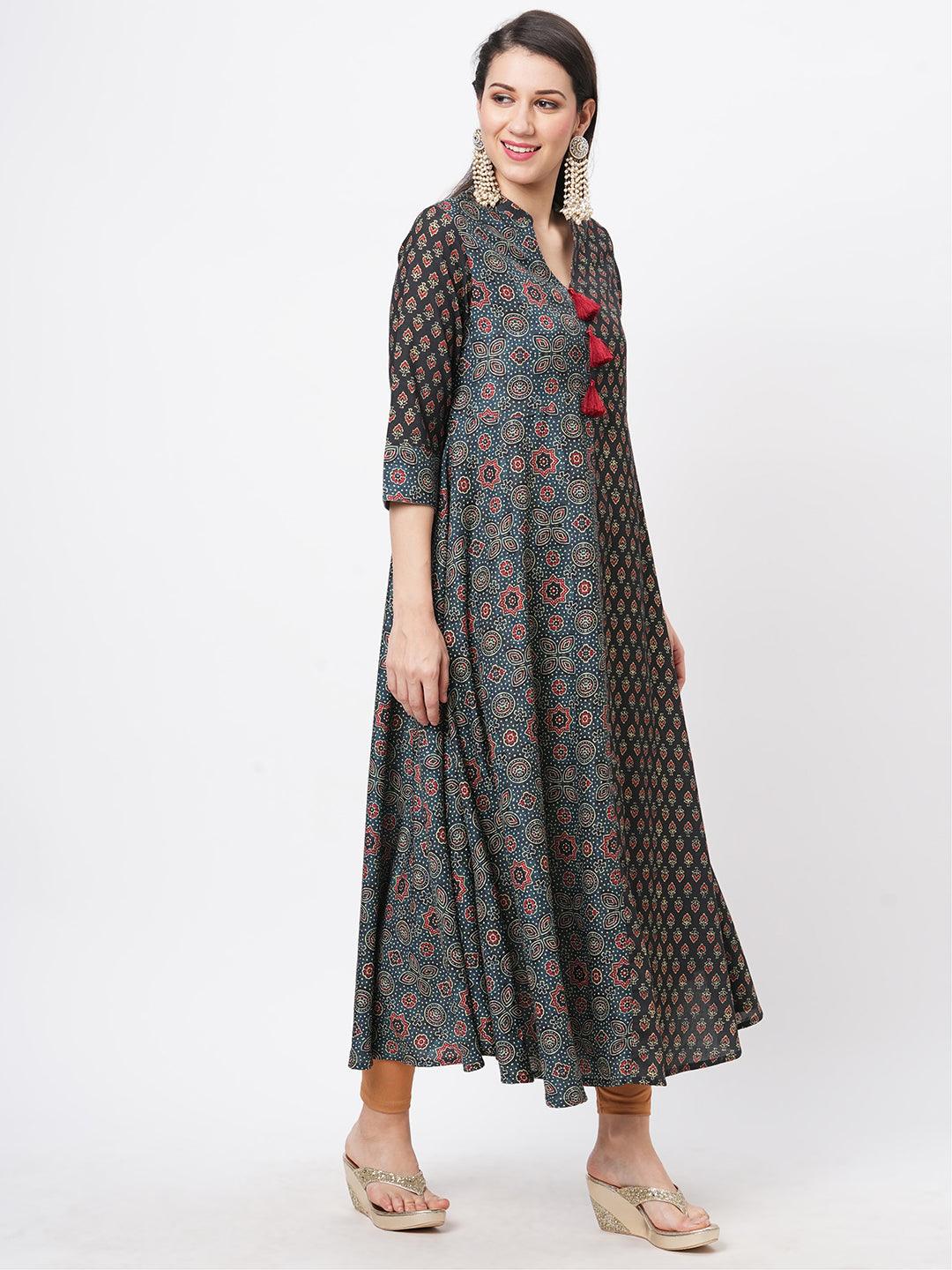 Hashtag Be forest green two print long flared kurta complimenting each other with contrast color tassel at the neck.