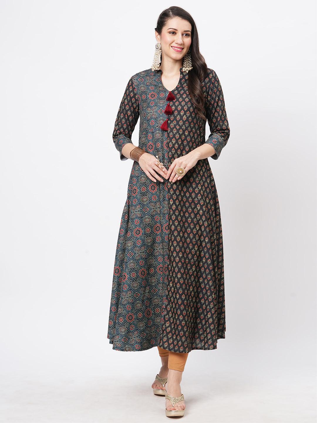 Hashtag Be forest green two print long flared kurta complimenting each other with contrast color tassel at the neck.
