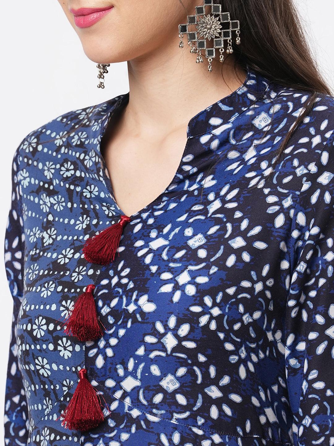 Hashtag Be Indigo two print long flared kurta complimenting each other with contrast color tassel at the neck.