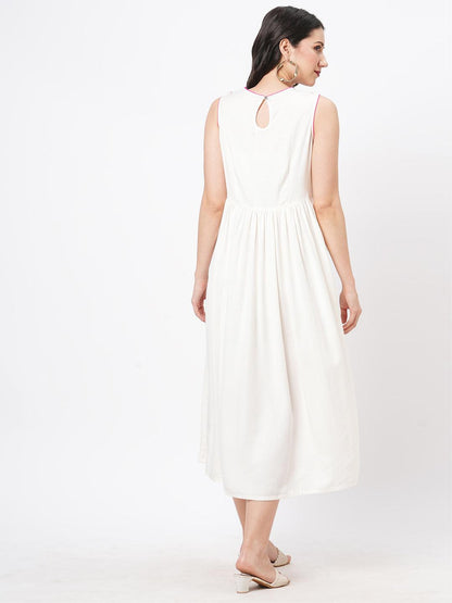 Hashtag Be Featuring a Offwhite boho calf length airy dress with tassel and embroidery