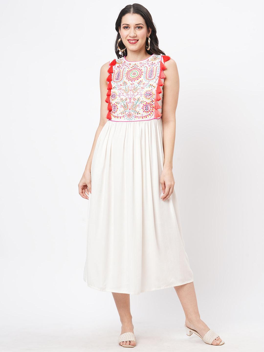 Hashtag Be Featuring a Offwhite boho calf length airy dress with tassel and embroidery