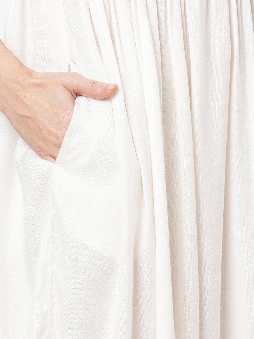 Hashtag Be Featuring a Offwhite boho calf length airy dress with tassel and embroidery