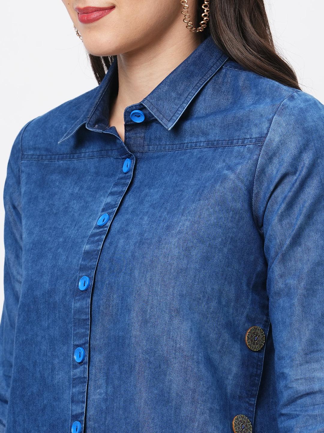 Hashtag Be Denim blue in sturdy washed cotton shirt with collar and button down front and high low hem with embroidery at the back