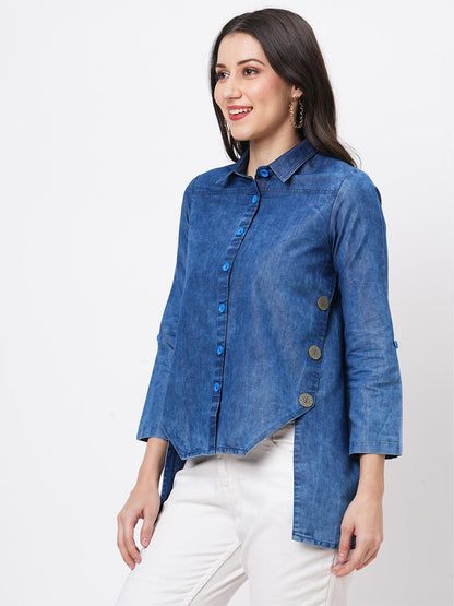 Hashtag Be Denim blue in sturdy washed cotton shirt with collar and button down front and high low hem with embroidery at the back