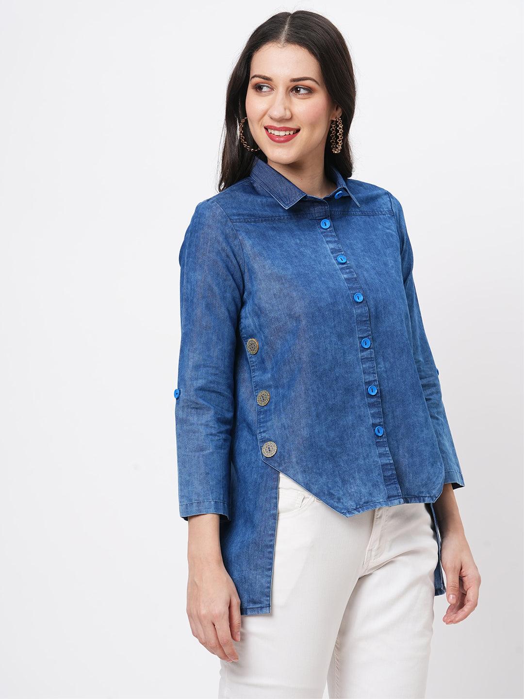 Hashtag Be Denim blue in sturdy washed cotton shirt with collar and button down front and high low hem with embroidery at the back